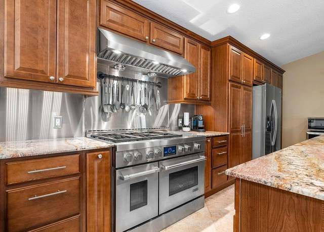 Property at 9077 NW 49th Pl, Coral Springs, FL 33067, 4 beds, 3 baths