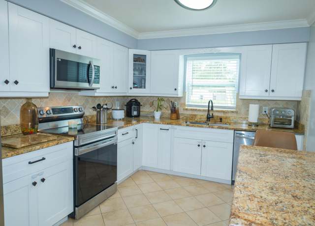 Property at 411 Forest Estate Dr, West Palm Beach, FL 33415, 4 beds, 2 baths