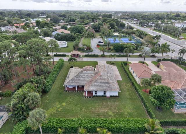 Property at 100 N Country Club Blvd, Atlantis, FL 33462, 3 beds, 3 baths