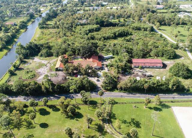 Property at 2438 Palm Deer Dr, Loxahatchee, FL 33470, 6 beds, 5.5 baths