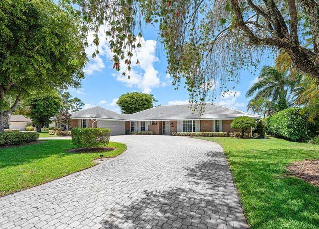 Property at 489 S Country Club Dr, Atlantis, FL 33462, 4 beds, 3 baths