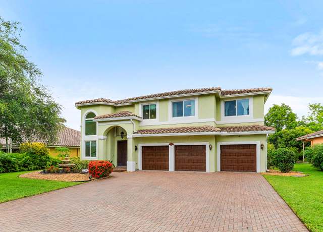 Property at 5783 NW 48th Ct, Coral Springs, FL 33067, 4 beds, 3 baths
