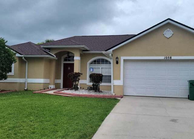 Property at 1058 SW Calmar Ave, Port Saint Lucie, FL 34953, 4 beds, 3 baths