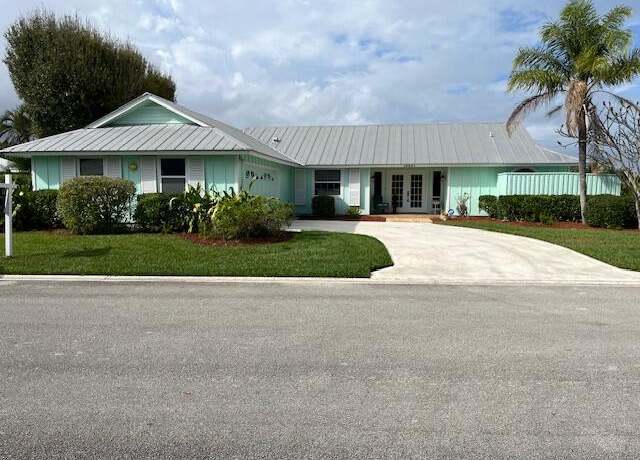 Property at 10691 SE Jupiter Narrows Dr, Hobe Sound, FL 33455, 3 beds, 2 baths