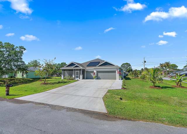 Property at 1302 SE Naples Ln, Port Saint Lucie, FL 34983, 4 beds, 3 baths