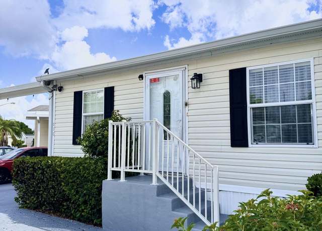 Property at 138 Plantation Blvd, Greenacres, FL 33467, 4 beds, 2 baths