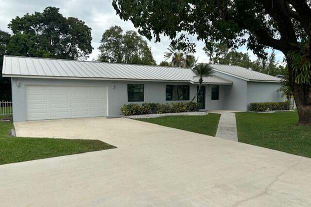 Loxahatchee Groves, FL Homes with Garages For Sale