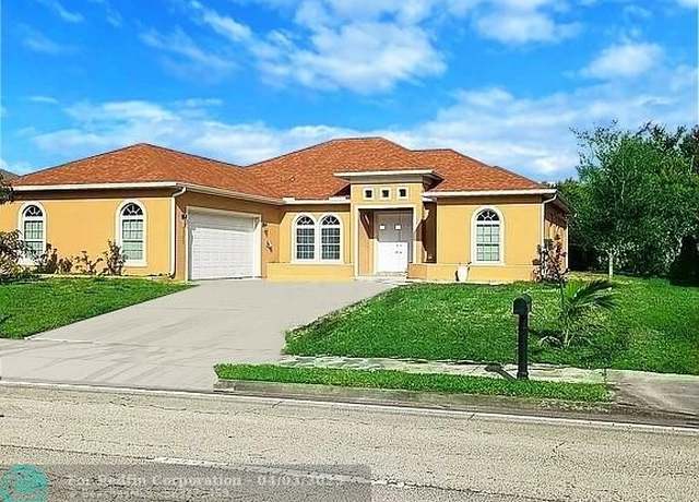 Property at 1711 SE Airoso Blvd, Port St. Lucie, FL 34984, 4 beds, 3 baths