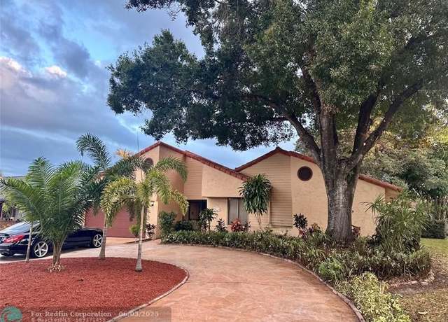 Property at 10998 NW 1st Mnr, Coral Springs, FL 33071, 4 beds, 3 baths