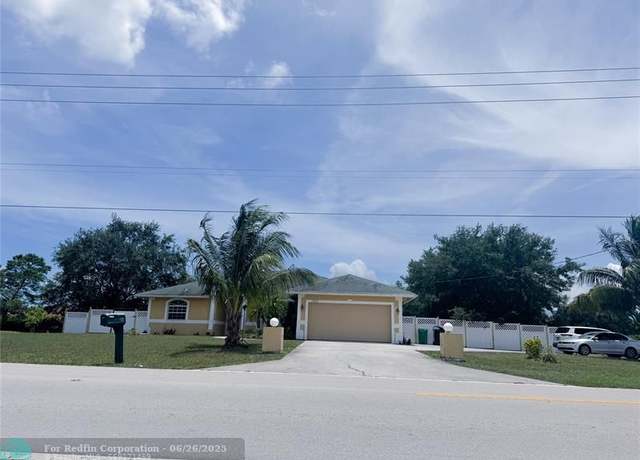 Property at 180 SW Oakridge Dr, Port St. Lucie, FL 34984, 4 beds, 3.5 baths