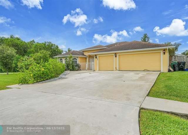 Property at 100 SW Lion Ln, Port St. Lucie, FL 34953, 4 beds, 3 baths