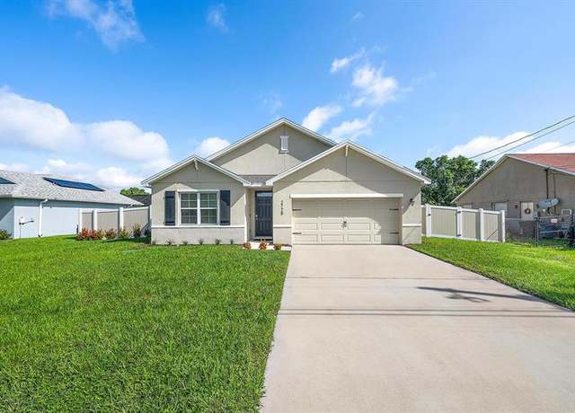 Property at 2725 SE Garfield Ave, Port St. Lucie, FL 34952, 4 beds, 2 baths