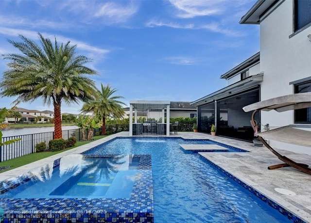 Property at 10915 Moore Dr, Parkland, FL 33076, 5 beds, 5.5 baths