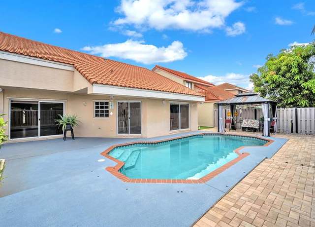 Property at 9520 NW 18th Dr, Plantation, FL 33322, 3 beds, 2 baths