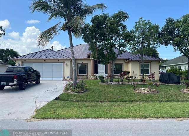 Property at 1752 SW Starman Ave, Port St. Lucie, FL 34953, 4 beds, 3 baths