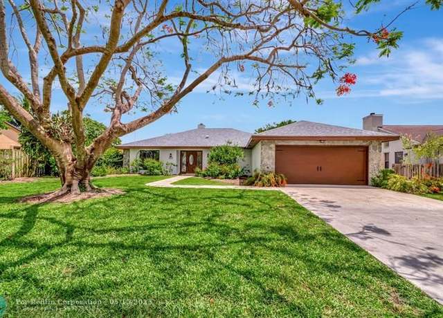 Property at 7415 Woodland Creek Ln, FL 33467, 4 beds, 2 baths