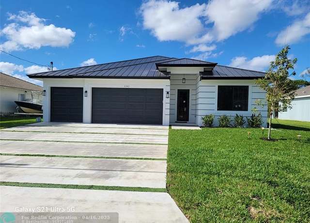 Property at 1701 SW Cannon Ave, Port St. Lucie, FL 34953, 4 beds, 3 baths