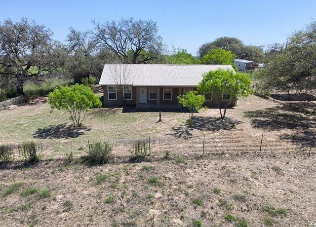 Property at 1722 County Road 676, Devine, TX 78016-4653, 4 beds, 3 baths