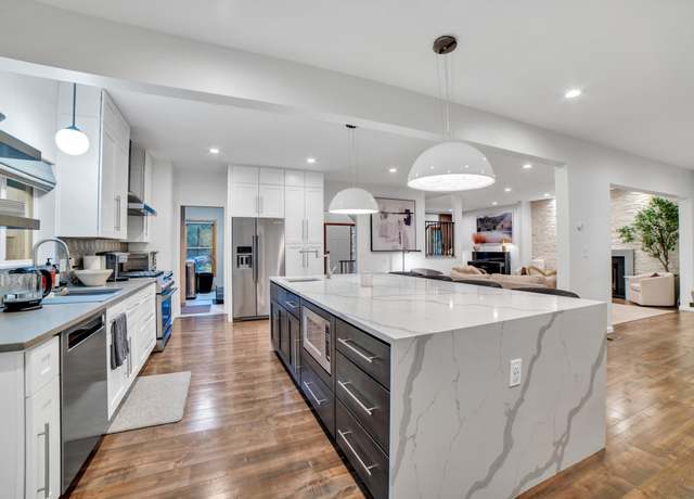 Property at 11260 Hidden Oaks Ct N, Champlin, MN 55316, 5 beds, 4 baths