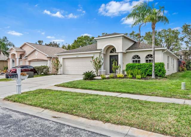 Property at 31123 Stone Arch Ave, Wesley Chapel, FL 33545, 4 beds, 2 baths