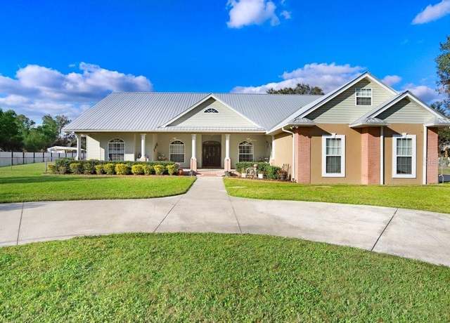 Property at 1702 W Knights Griffin Rd, Plant City, FL 33565, 3 beds, 4.5 baths