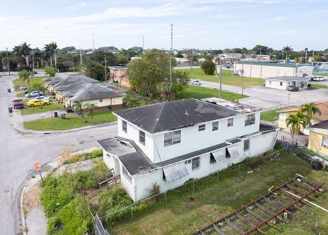 Property at 857 SW Avenue C Pl, Belle Glade, FL 33430, 3 beds, 3 baths