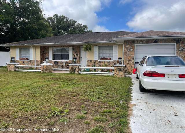 Property at 1127 Lodge Cir, Spring Hill, FL 34606, 4 beds, 2 baths