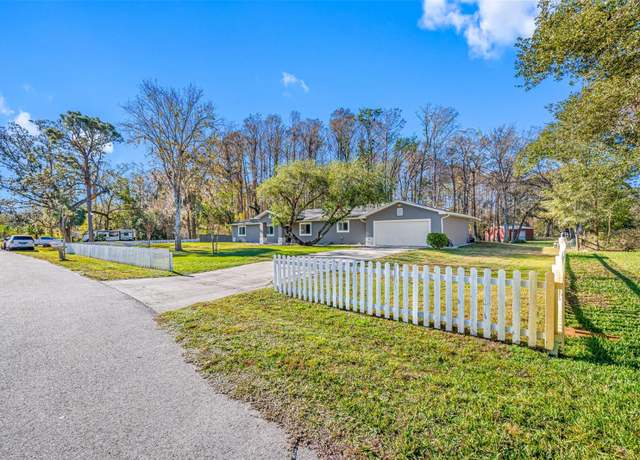 Property at 11201 Knotty Pine Dr, New Port Richey, FL 34654, 4 beds, 3 baths