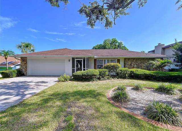 Property at 13725 Oak Forest Blvd N, Seminole, FL 33776, 4 beds, 2 baths