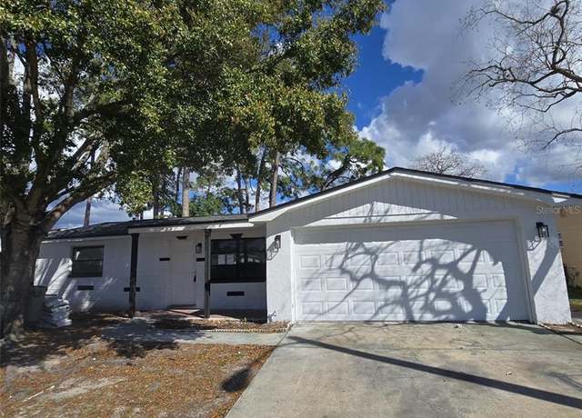 Property at 10018 Freestone Ln, Port Richey, FL 34668, 4 beds, 3 baths