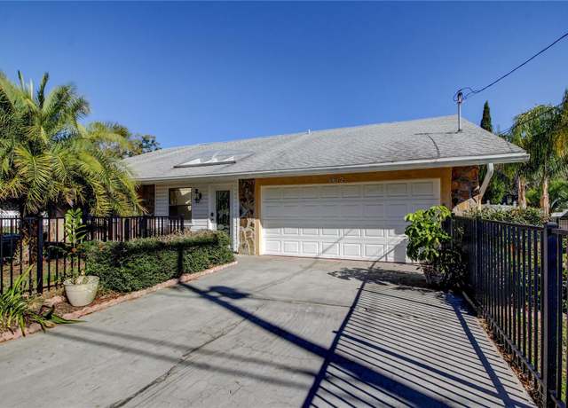 Property at 1612 Sunset Dr, Tarpon Springs, FL 34689, 4 beds, 3 baths