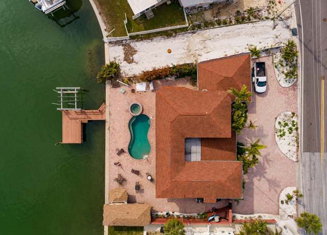 Property at 7013 Boca Ciega Dr, St Pete Beach, FL 33706, 5 beds, 5 baths