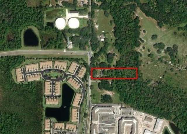 Property at 1225 S Goodman Rd, Champions Gate, FL 33896, 4 beds, 2 baths