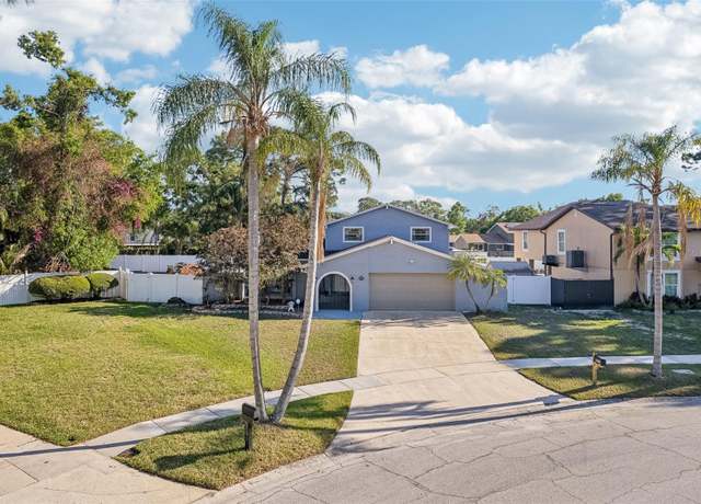 Property at 8019 Greenshire Dr, Tampa, FL 33634, 4 beds, 3 baths