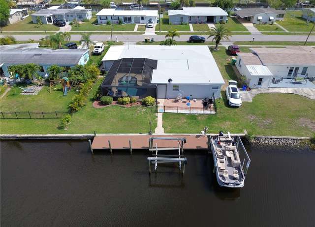 Property at 136 Godfrey Ave NE, Port Charlotte, FL 33952, 3 beds, 2 baths