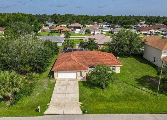 Property at 9 Big Bear Ln, Palm Coast, FL 32137, 4 beds, 2.5 baths
