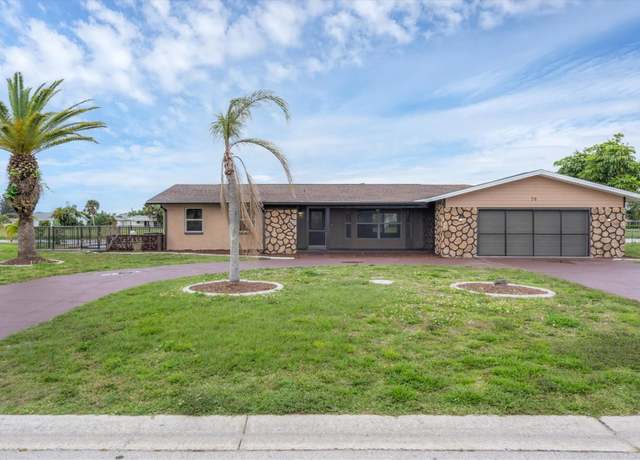 Property at 76 Caddy Rd, Rotonda West, FL 33947, 4 beds, 3 baths