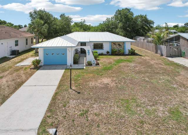 Property at 953 Tropical Ave NW, Port Charlotte, FL 33948, 3 beds, 2 baths