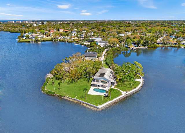 Property at 7049 Peninsular Dr, New Port Richey, FL 34652, 5 beds, 3 baths