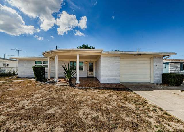Property at 1551 Derrick St, Holiday, FL 34690, 3 beds, 2.5 baths
