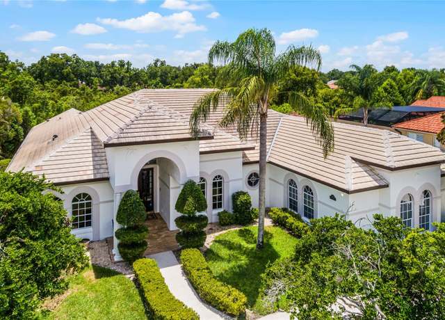 Property at 8708 Lost Cove Dr, Orlando, FL 32819, 4 beds, 3.5 baths