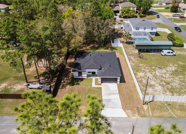 Property at 1413 W America Pl, Citrus Springs, FL 34434, 4 beds, 3 baths