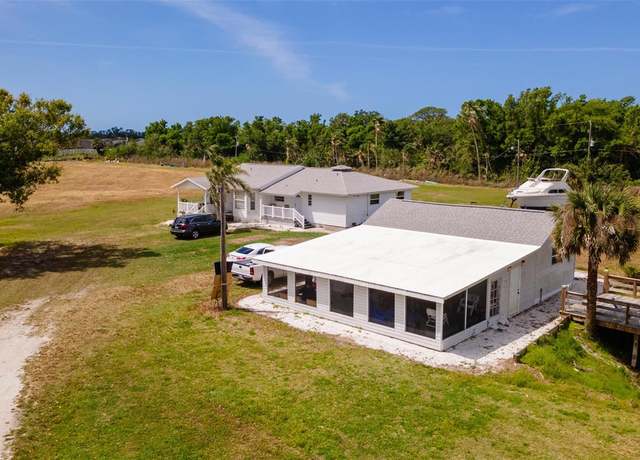 Property at 1727 E Manasota Beach Rd, Englewood, FL 34223, 4 beds, 2.5 baths