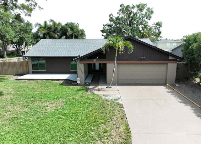 Property at 11525 Country Oaks Dr, Tampa, FL 33618, 3 beds, 2 baths