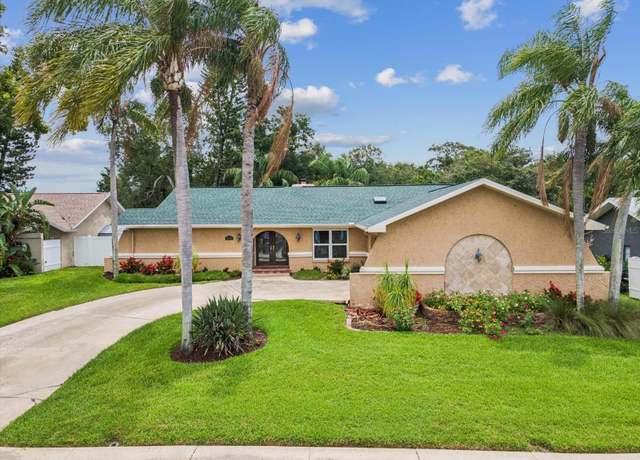 Property at 5110 Lake Valencia Blvd E, Palm Harbor, FL 34684, 4 beds, 2 baths