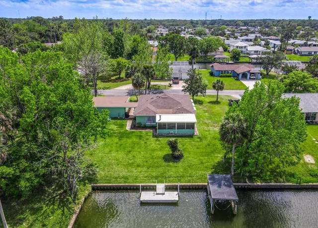 Property at 1 Cardinal Ct, Palm Coast, FL 32137, 4 beds, 2 baths