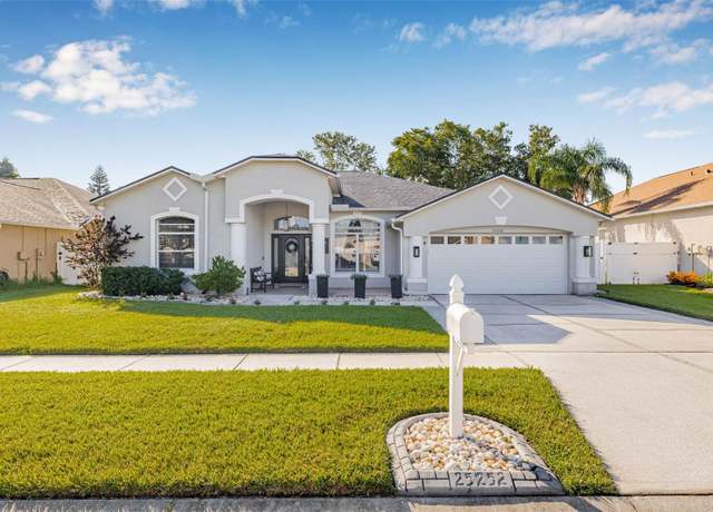Property at 25252 Conestoga Dr, Land O Lakes, FL 34639, 4 beds, 3 baths