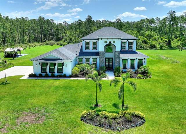 Property at 1702 Hidden Palms Dr, Davenport, FL 33897, 6 beds, 4.5 baths