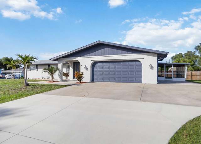 Property at 711 Forest Hill Ln NW, Port Charlotte, FL 33948, 4 beds, 3 baths