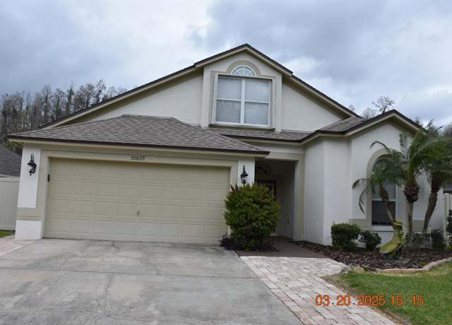 Property at 30829 Iverson Dr, Wesley Chapel, FL 33543, 4 beds, 2 baths